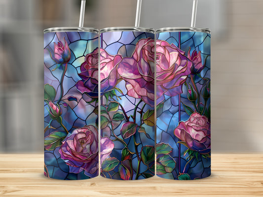 Three tumblers with stained glass rose floral design on a wooden surface.