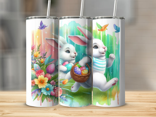 Three Easter bunny tumblers with colorful designs and floral accents.
