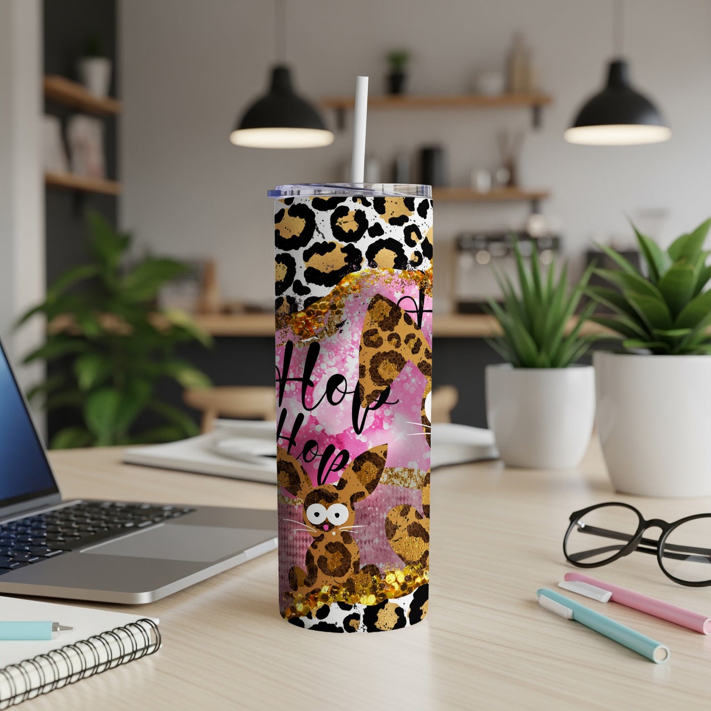 Leopard print tumbler with "Hop Hop" text and a bunny design.