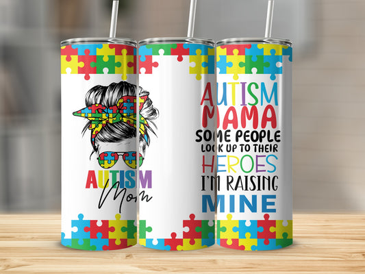 Autism Mama tumbler with puzzle pieces and text.