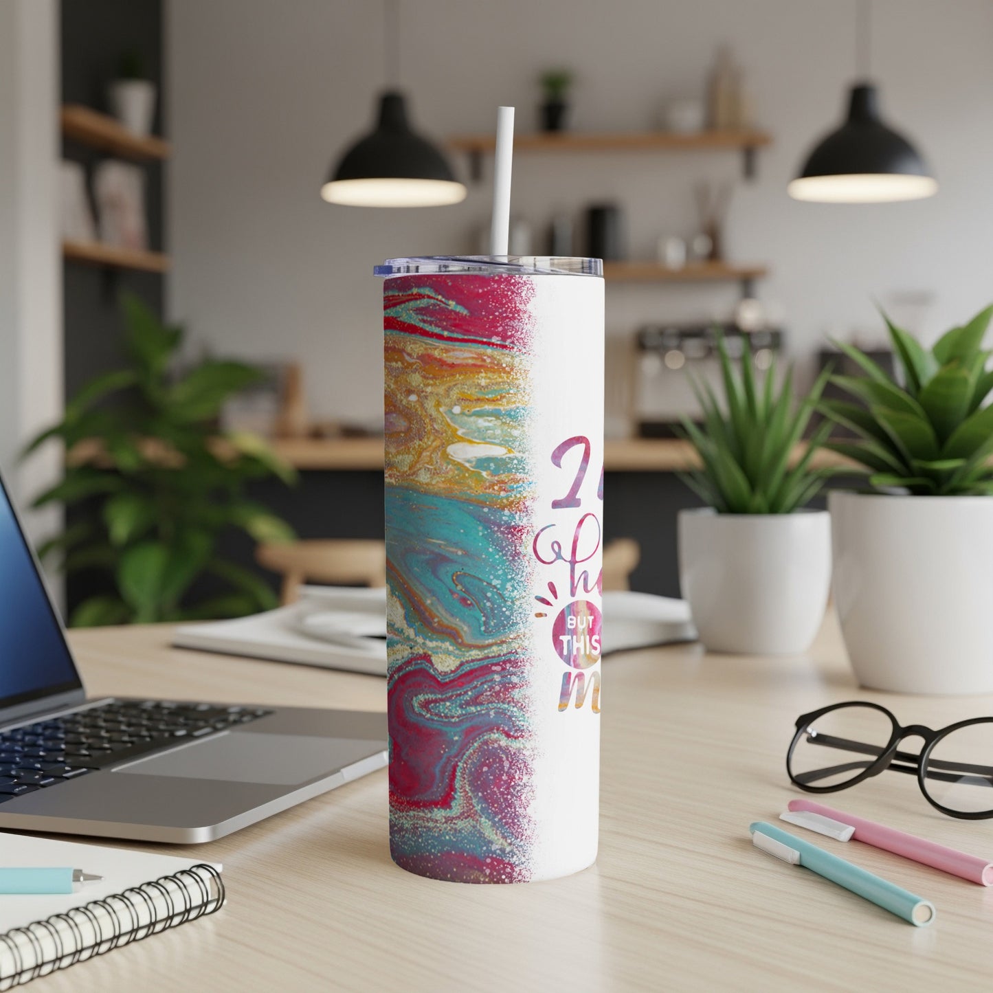 White tumbler with colorful marbled design and "2 hottest but this mom" text.