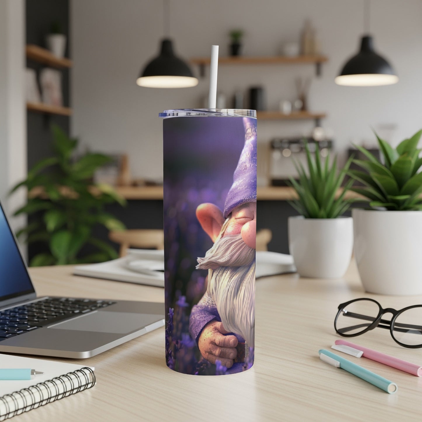 Purple gnome tumbler with lavender background on a desk.