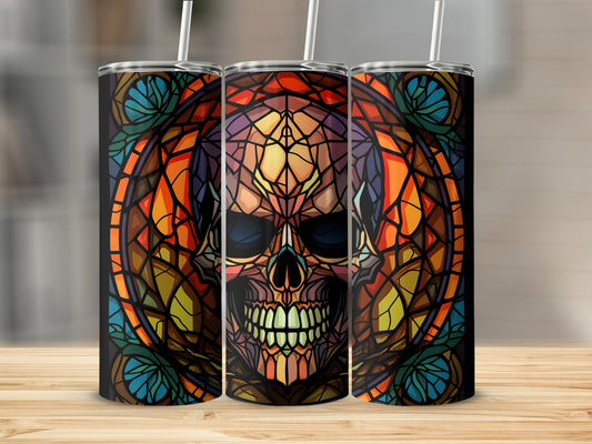 Stained glass skull design on three black skinny tumblers.