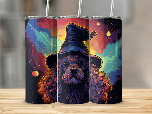 Dark curly dog wearing a witch hat with colorful cosmic background.