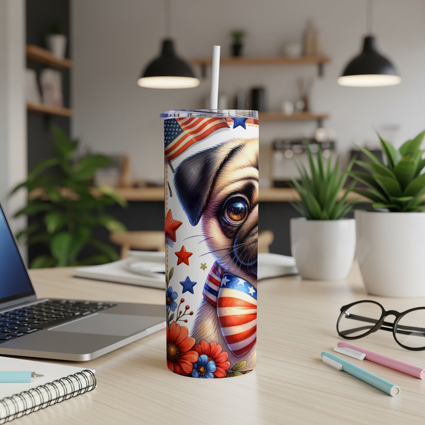 Pug wearing American flag bandana on patriotic tumbler with flowers.