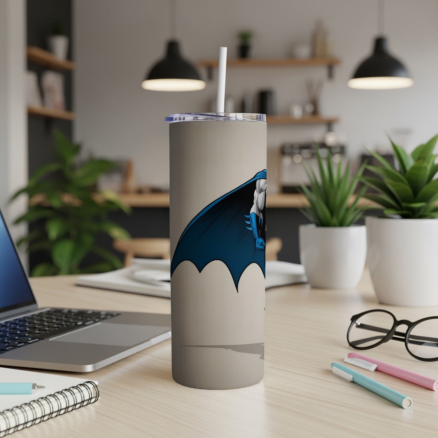 Tan tumbler featuring Batman's silhouette in blue cape.