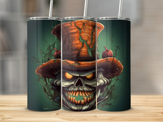 Tumbler with a spooky skull wearing a pumpkin hat and glowing eyes.