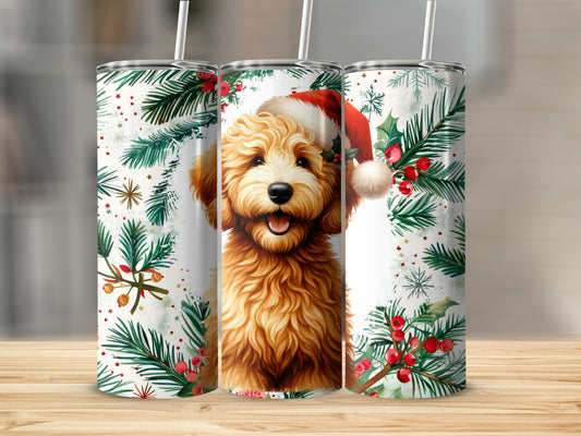 Goldendoodle wearing Santa hat with holiday greenery and berries.