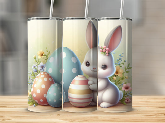 Easter bunny with decorated eggs and flowers on a wooden surface.