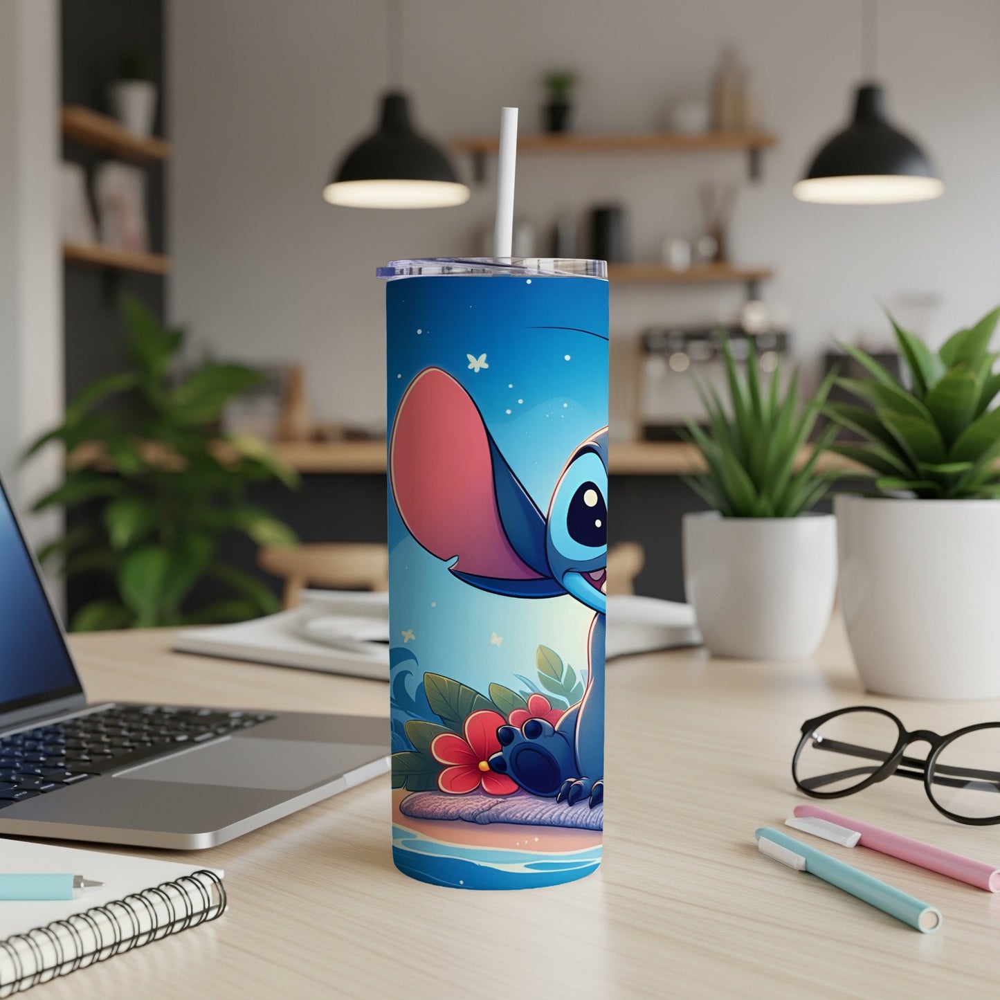 Cartoon Stitch character on a blue travel tumbler with a straw.