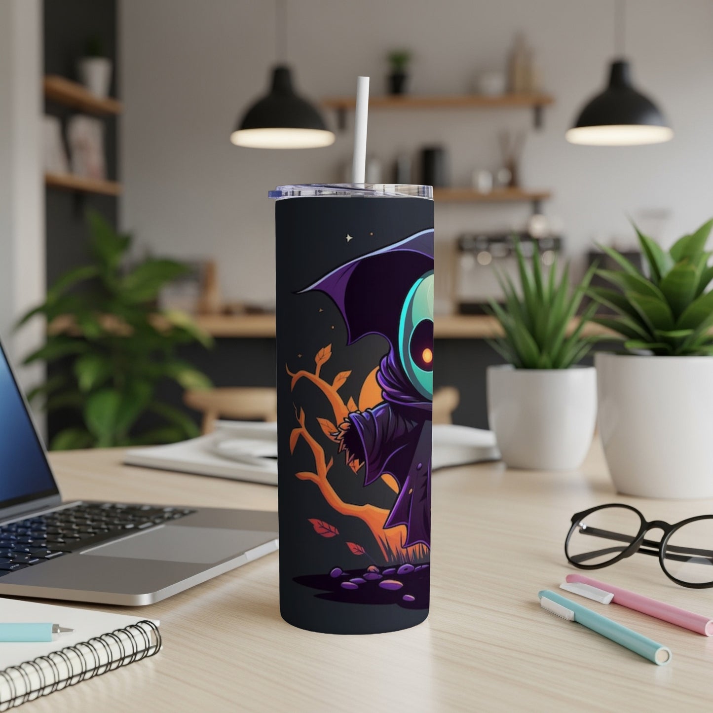 Tumbler with a cartoon grim reaper illustration and a straw.
