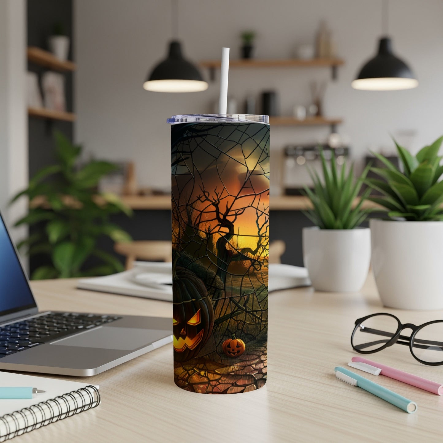 Halloween tumbler with pumpkins, spooky trees, and spiderwebs.