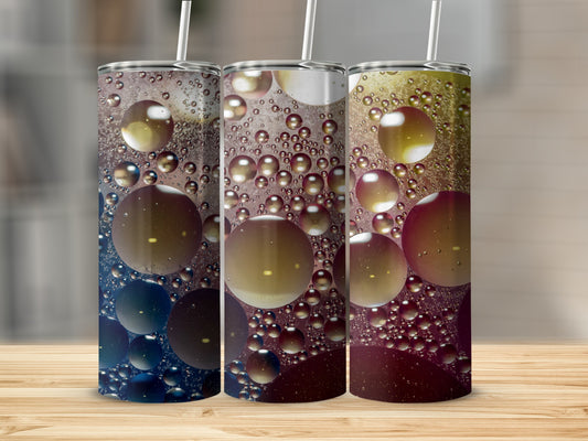 Three tumblers with bubble and liquid abstract art designs.