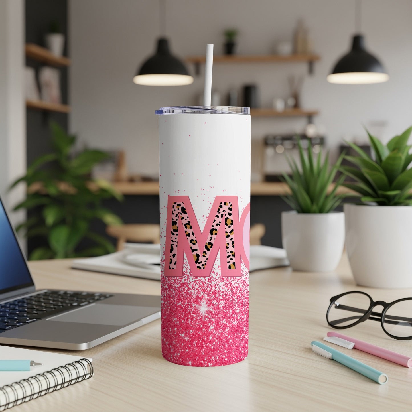 White tumbler with "Mom" in leopard print and pink glitter.