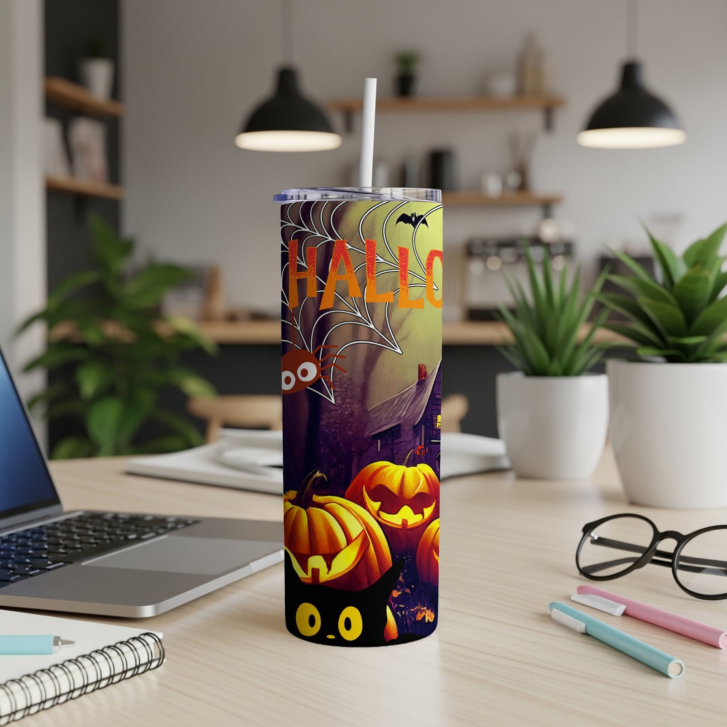 Halloween tumbler with pumpkins, spider, bat, and black cat.
