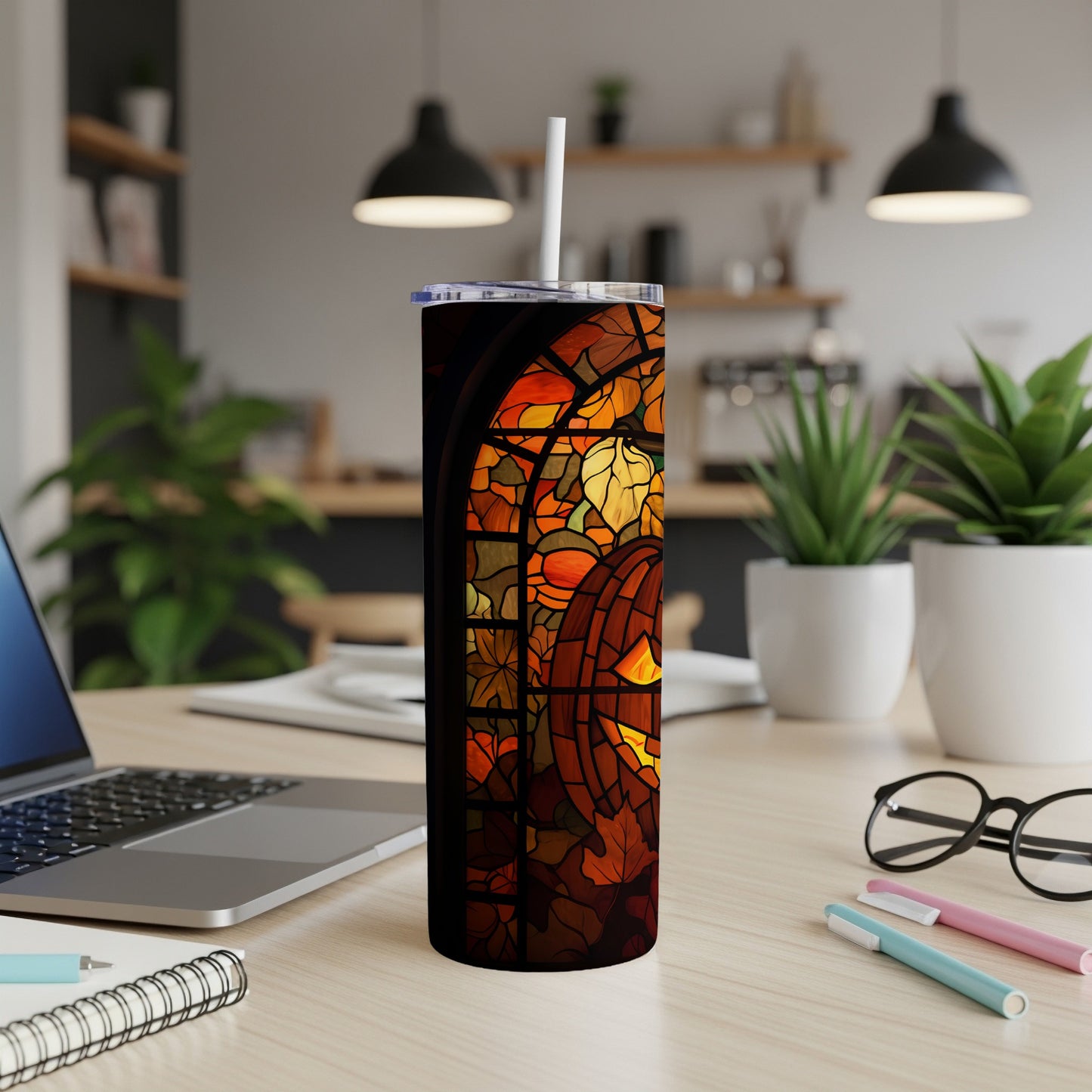 Tall tumbler with a stained-glass fall leaves design.