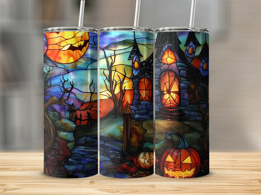 Three Halloween-themed tumblers with stained glass designs of haunted houses and pumpkins.
