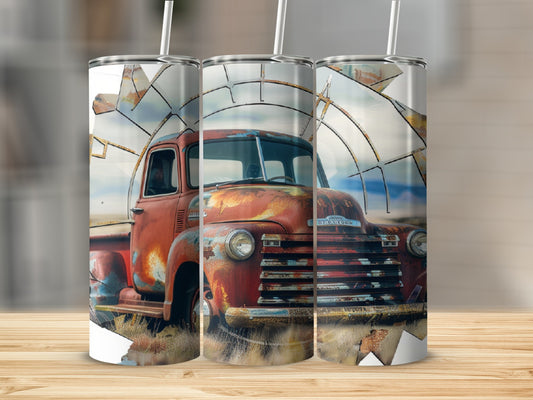 Rusty vintage truck with windmill behind it on a tumbler.