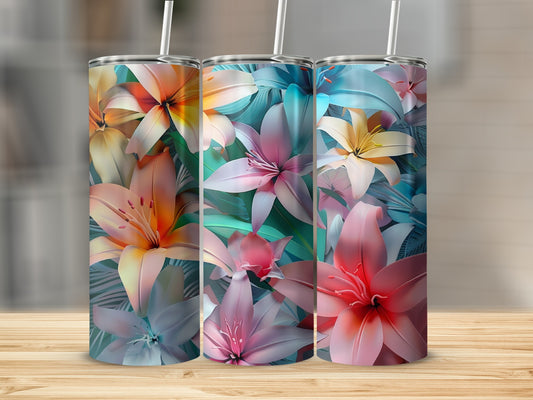 Three tumblers with tropical floral patterns and straws.