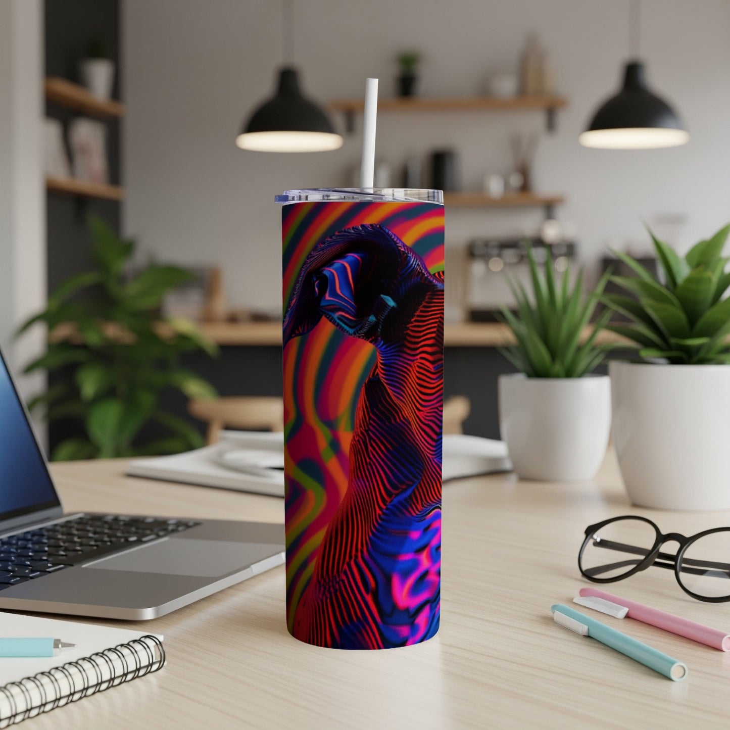 Tumbler with psychedelic abstract wavy pattern and white straw.
