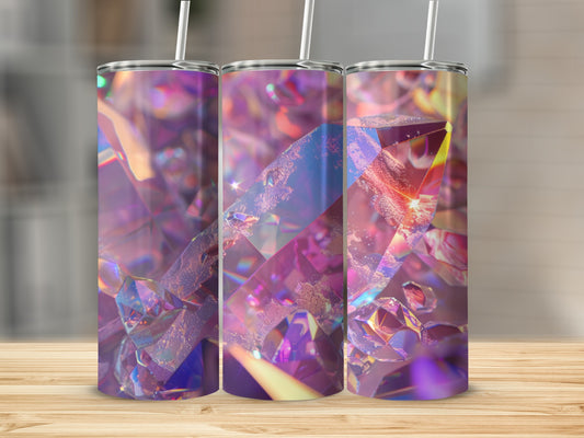 Three tumblers with iridescent crystal faceted designs on a wooden surface.