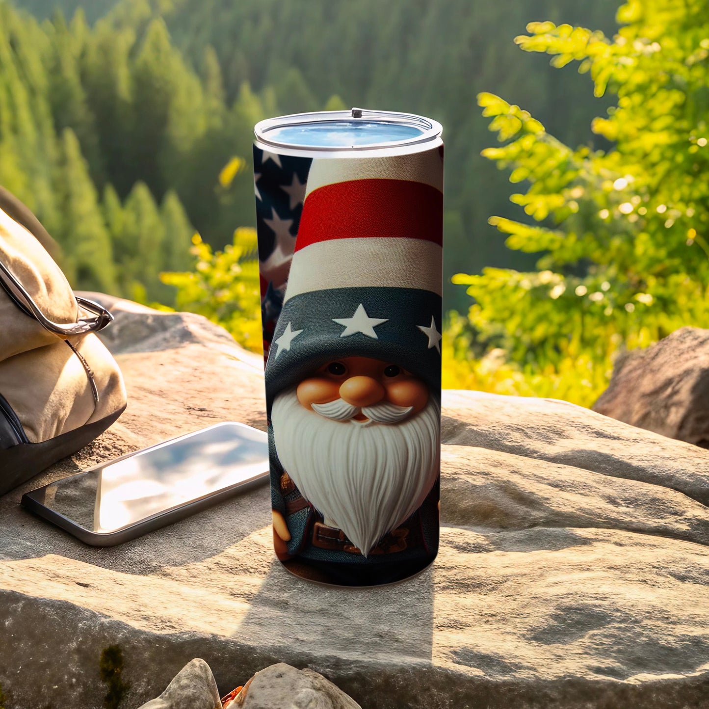 Gnome tumbler with American flag hat and stars, outdoors with phone and backpack.
