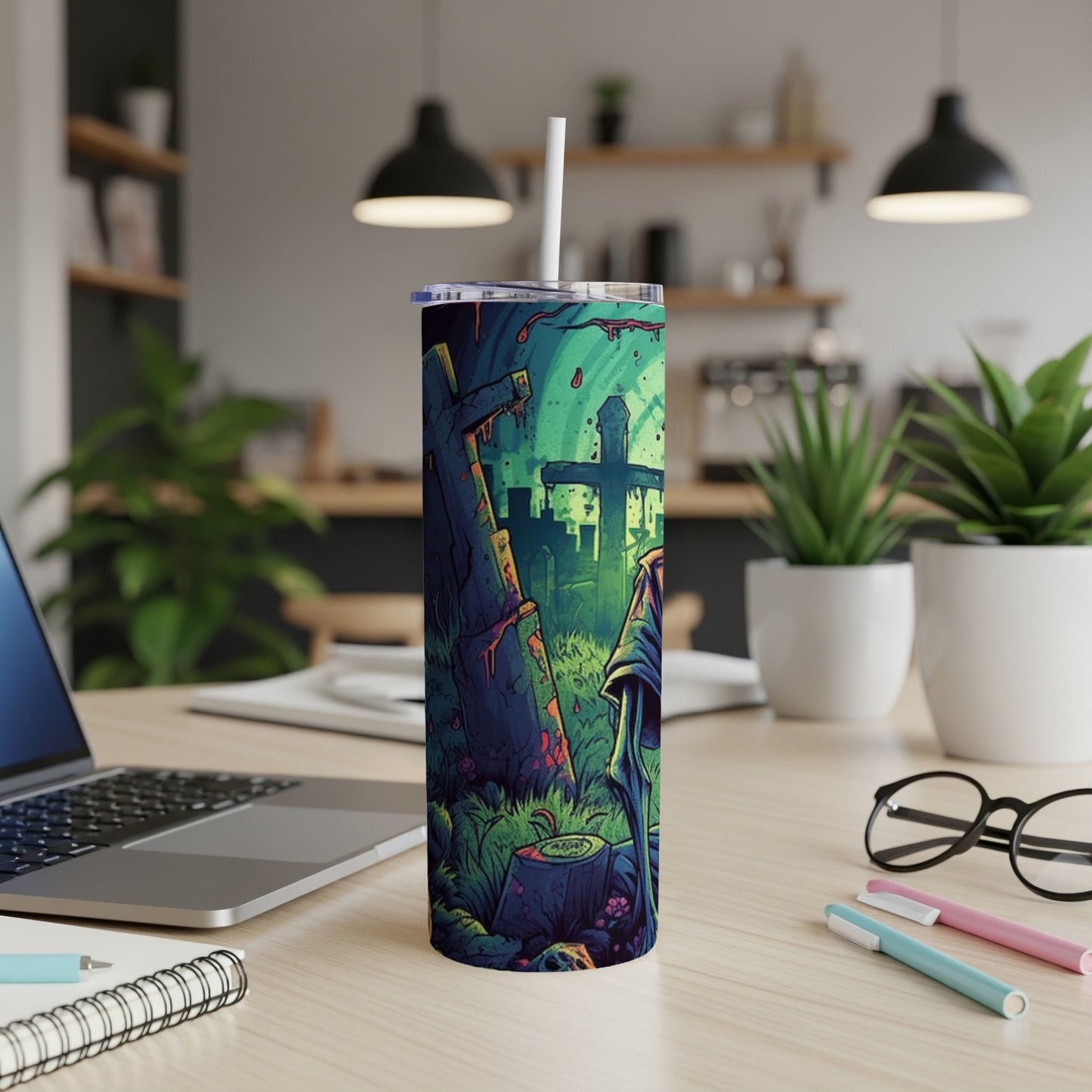 Tumbler with grim reaper in a graveyard design and a white straw.