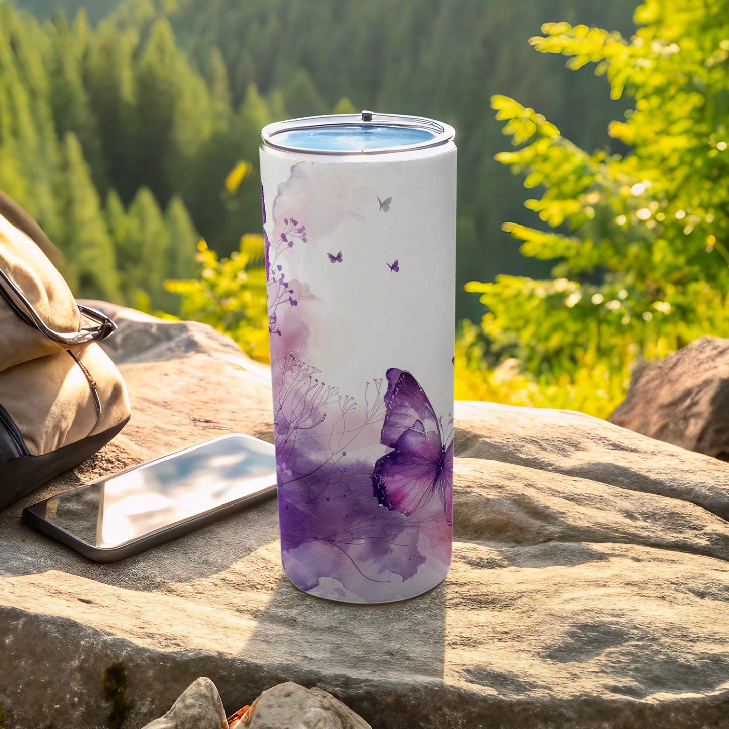 Purple butterfly and floral watercolor pattern on a white insulated tumbler.