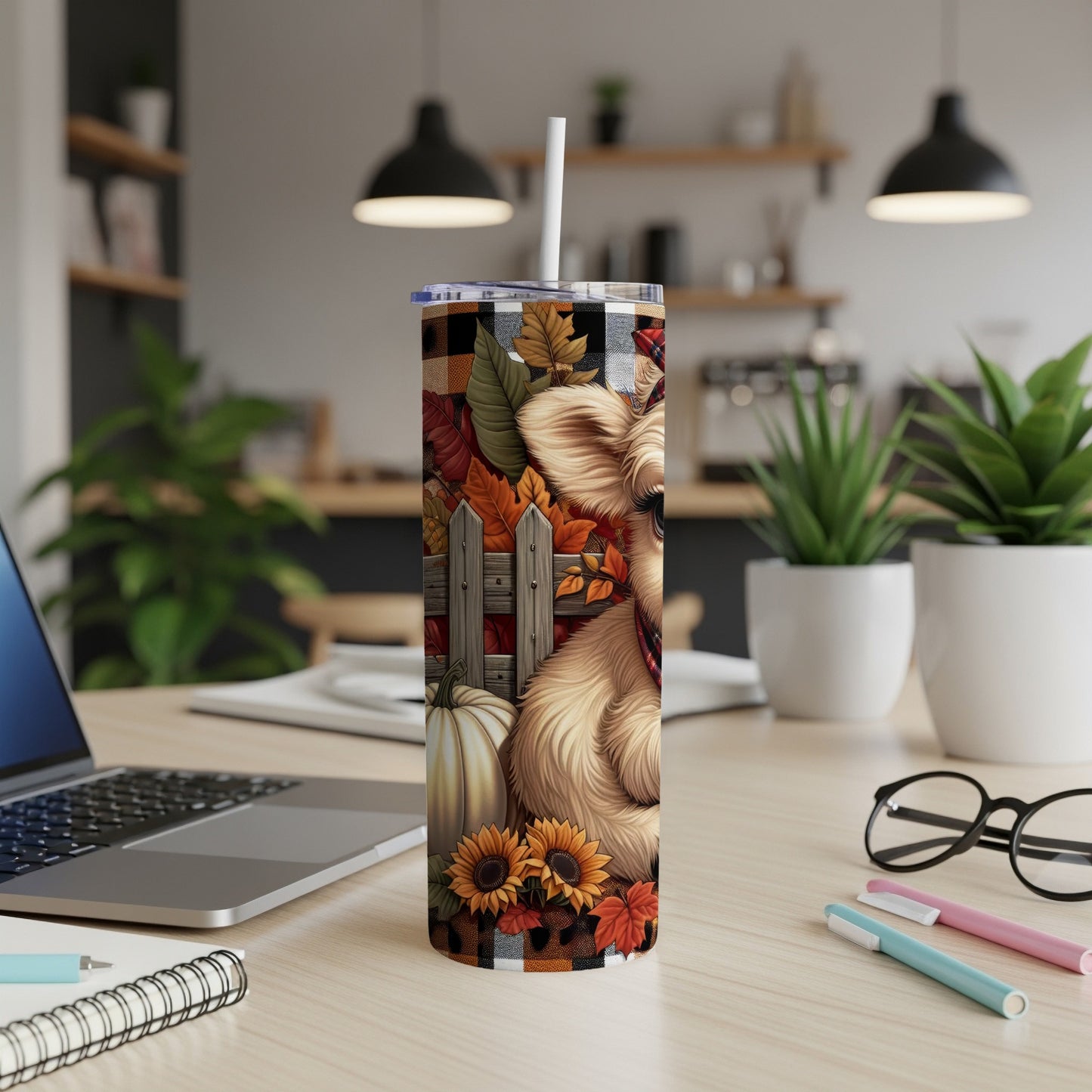 Dog, pumpkin, and sunflowers on a fall-themed tumbler with plaid background.
