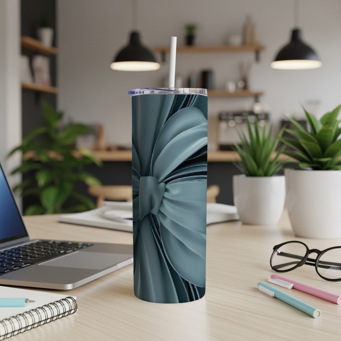 Blue metallic ribbon pattern on a tall tumbler with a straw.