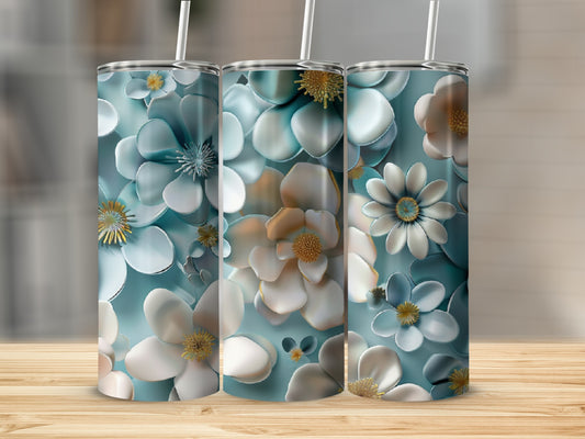 Three tumblers with a blue and white floral design on a wooden surface.