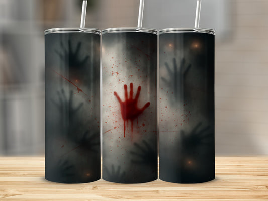 Three tumblers with spooky hand prints and blood splatters on a wooden surface.