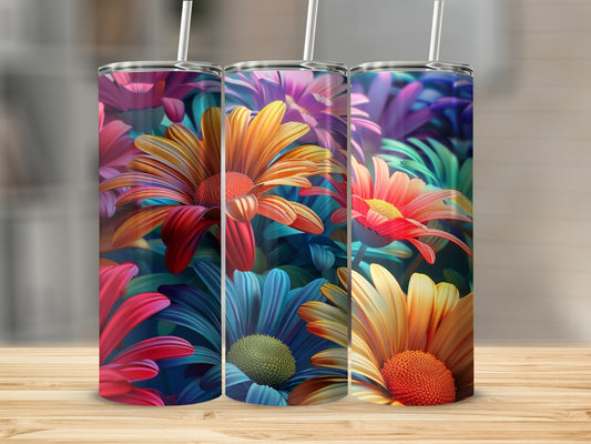 Three tumblers with colorful floral designs, featuring daisies and tropical leaves.