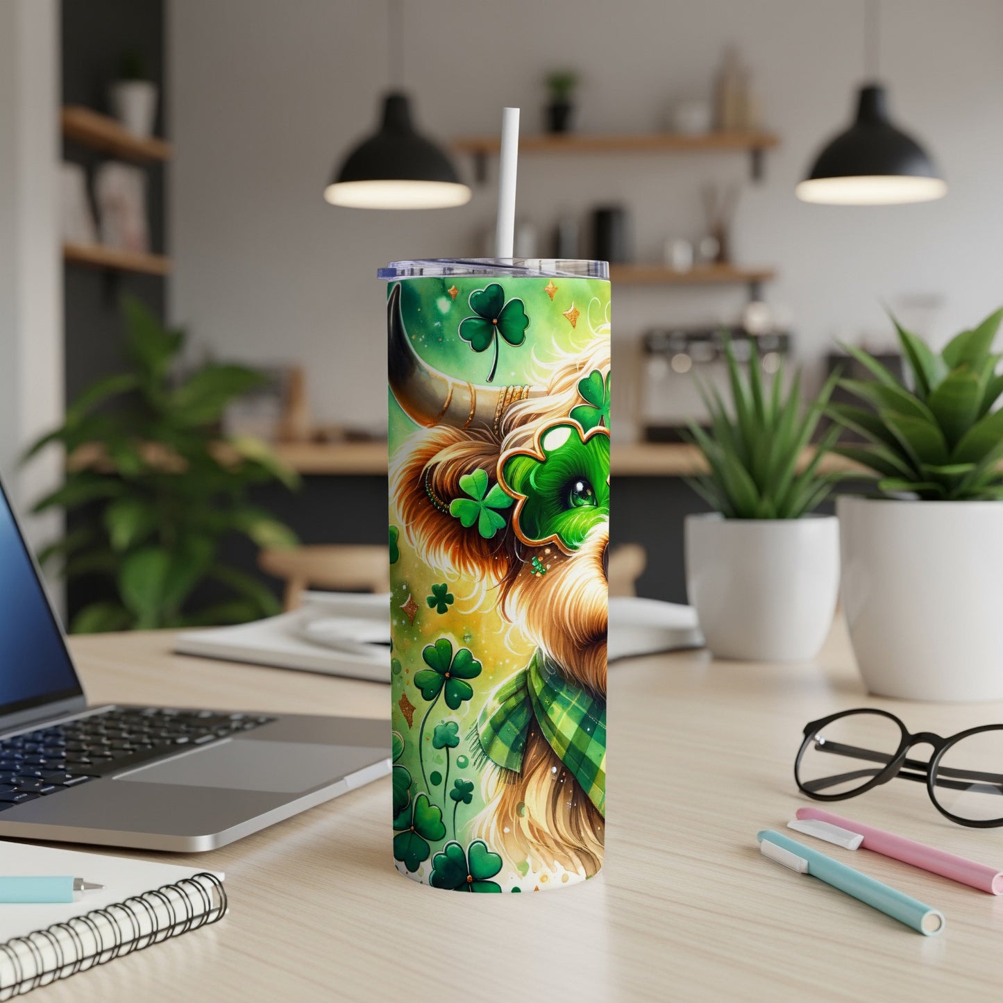 Highland cow with shamrocks and plaid pattern on a green tumbler.