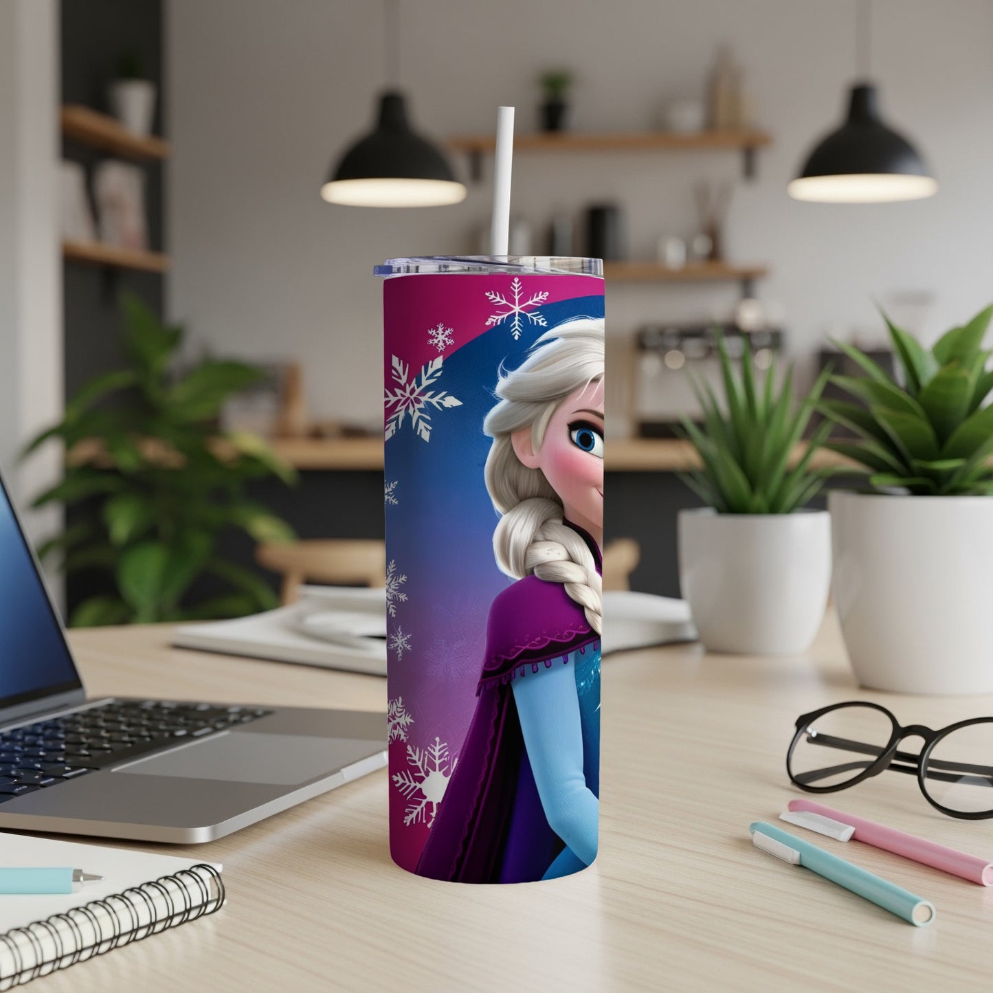 Elsa from Frozen on a pink and purple tumbler with snowflakes.