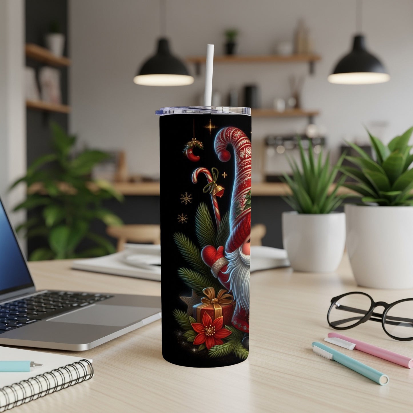 Christmas gnome design on a black skinny tumbler with a straw.
