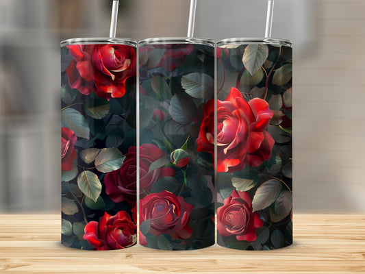 Three tumblers adorned with dark red roses and green leaves.