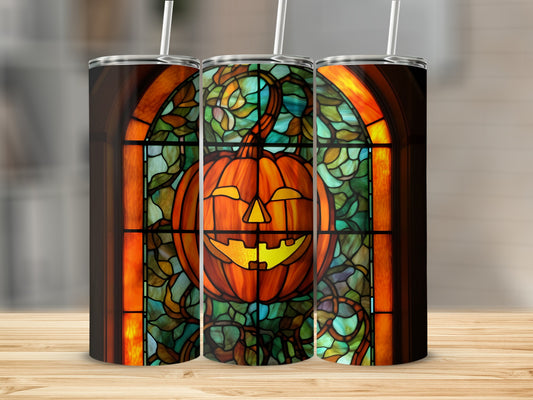 Three tumblers featuring stained glass pumpkin art with warm, glowing light.