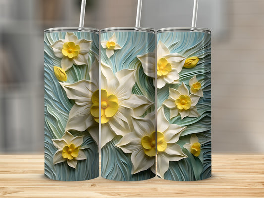 Three tall tumblers featuring a white and yellow daffodil floral pattern.