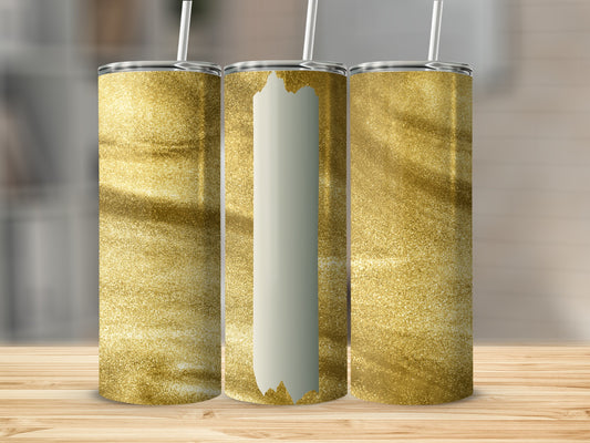 Three golden glitter tumblers with white vertical accents on a wooden surface.