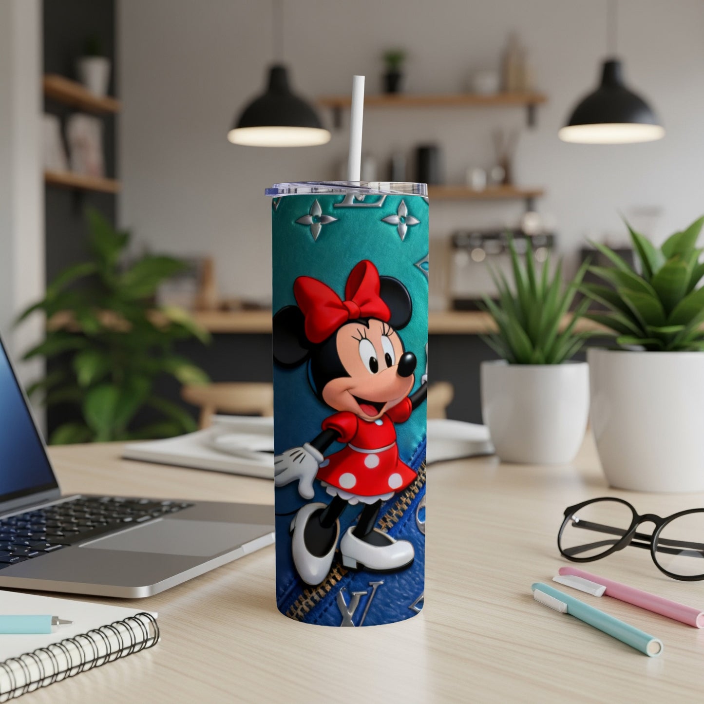 Minnie Mouse on a teal blue tumbler with red polka dot dress.