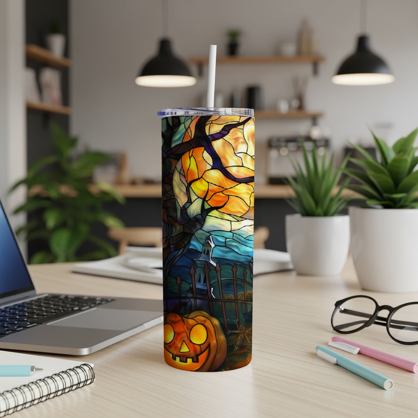 Halloween tumbler with pumpkin, fence, and stained-glass-style moon and trees.