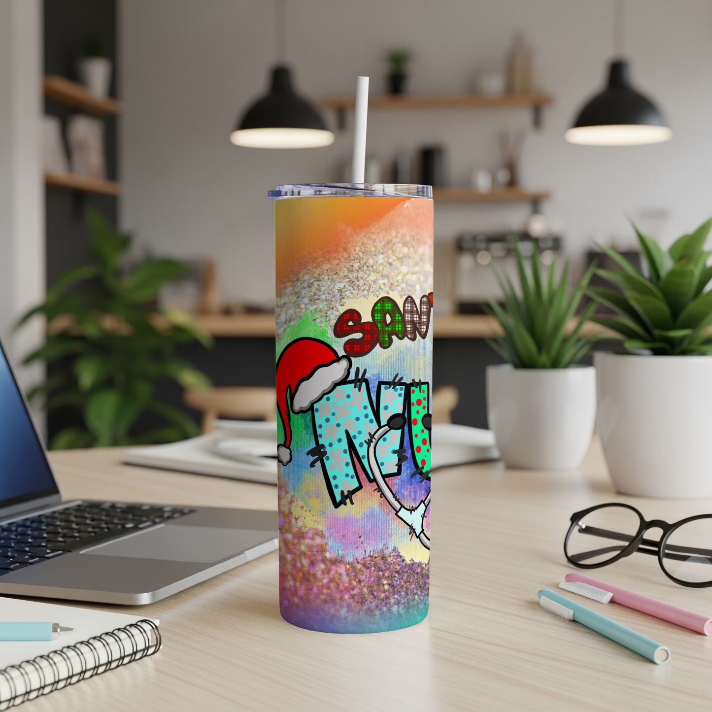 Tall skinny tumbler with Santa hat, "Santa" text, and colorful glitter background.