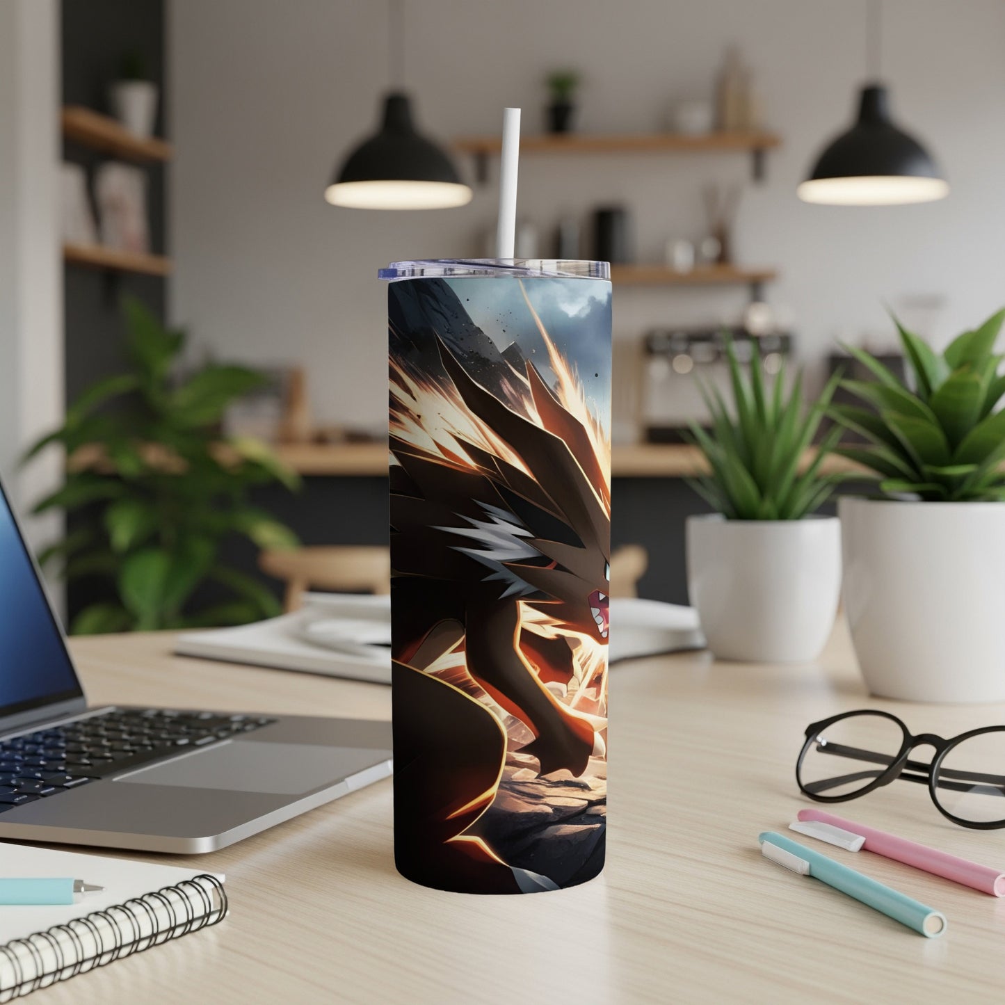 Tumbler with stylized dragon artwork, white straw, on a desk.