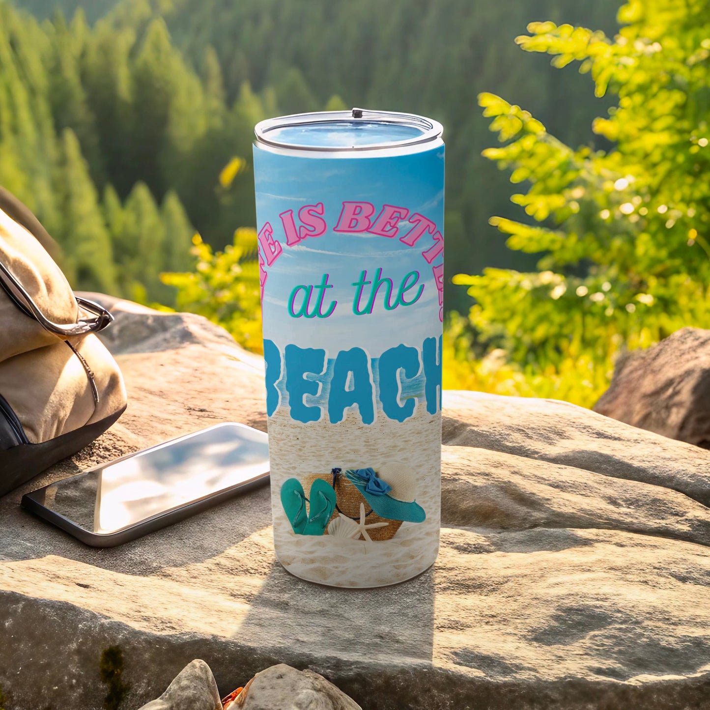 Blue tumbler with "Life is Better at the Beach" text and beach scene.
