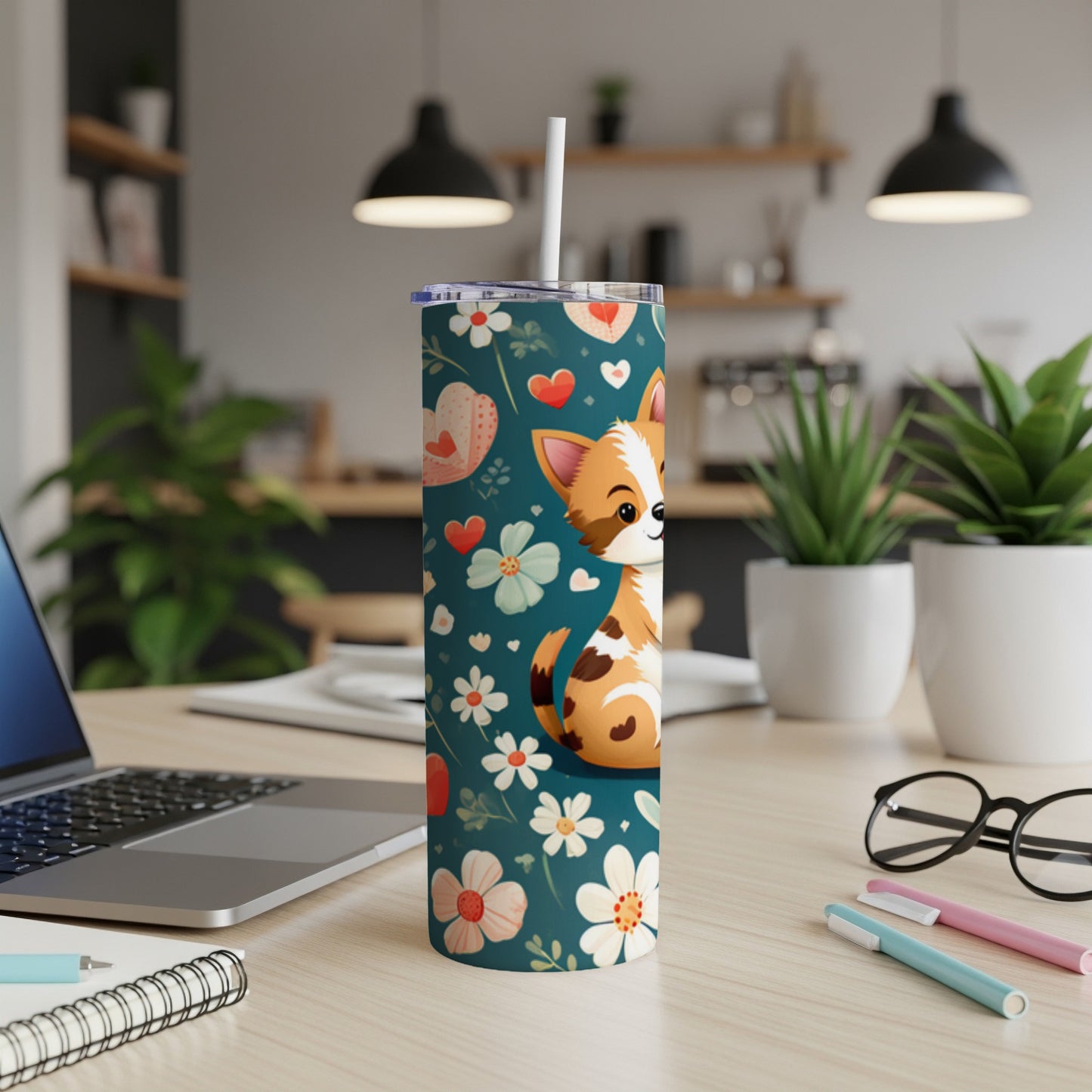 Chihuahua on a floral patterned tumbler with a straw.