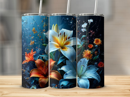 Three tumblers with vibrant lily designs against a dark, textured background.