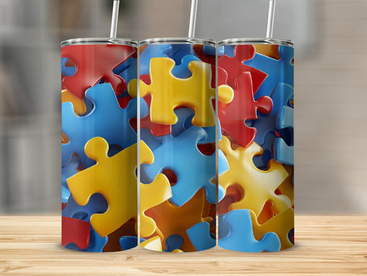 Three tumblers with a colorful, close-up autism puzzle piece pattern.