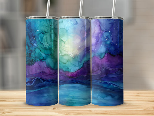 Three tumblers with a swirling galaxy and starry night sky design.