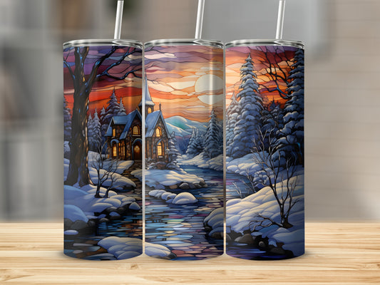 Winter scene with a church and snowy trees on a tumbler.